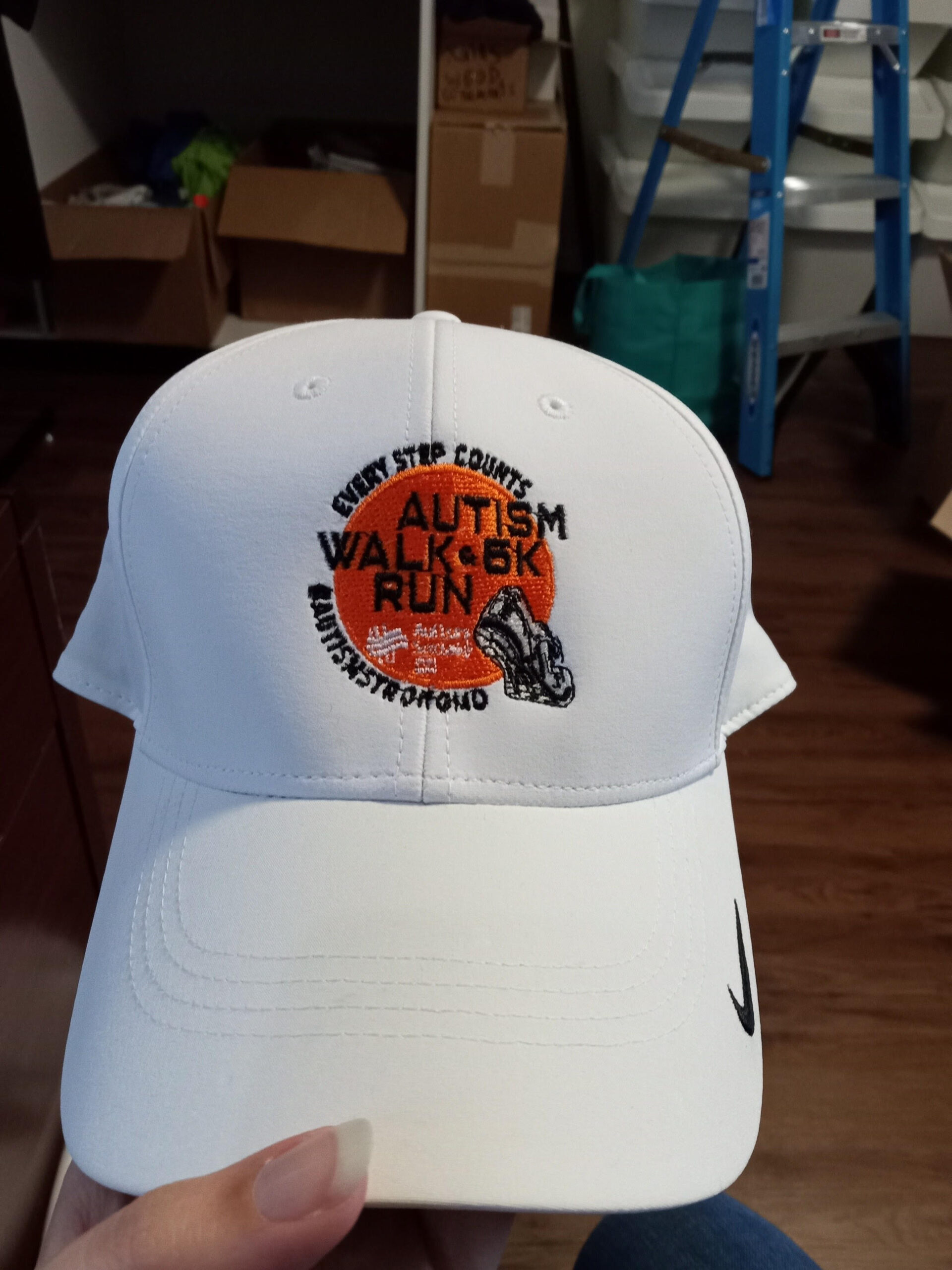 A white cap with a logo on it.