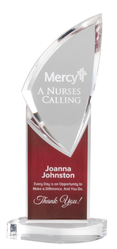 A glass award with the words mercy nurses are calling.